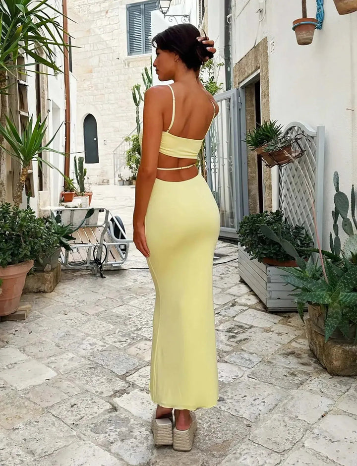 Figure-hugging yellow bodycon maxi dress for women, backless style, chic summer party & evening wear.