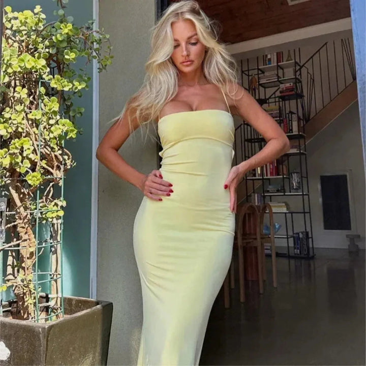 Striking yellow backless bodycon maxi dress, women's summer fashion, perfect for elegant party evenings.