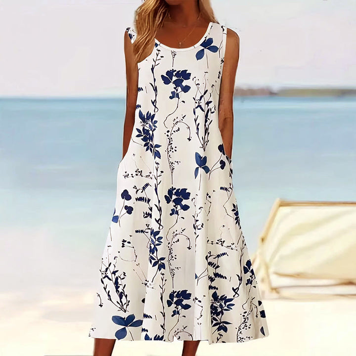 Women's floral sleeveless A-line midi dress with convenient pockets, perfect for summer casual elegance.