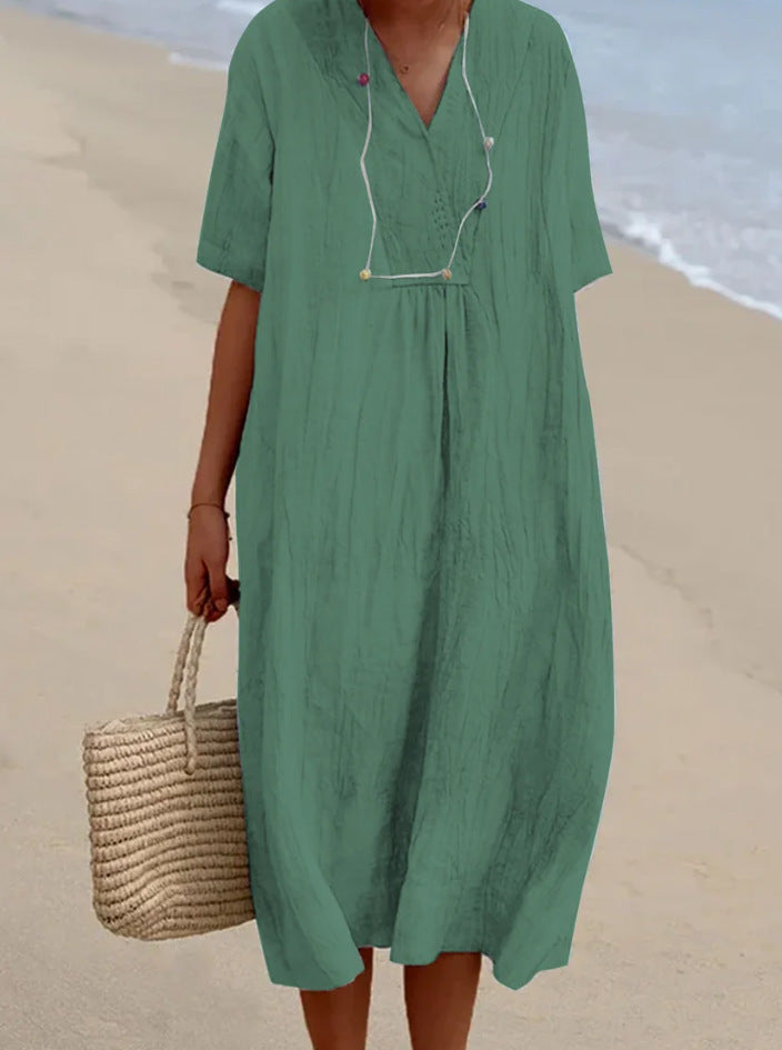 Versatile women's V-neck A-line midi dress with short sleeves. Ideal for elegant or casual summer occasions.