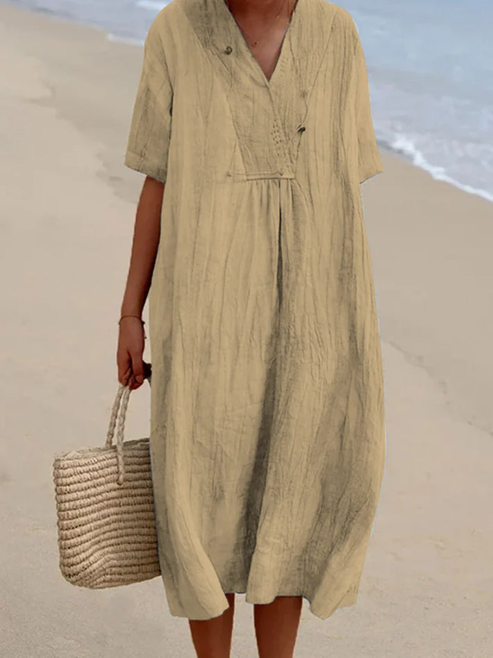 Breezy women's summer V-neck A-line midi dress. Short sleeves and comfortable fabric for warm weather style.