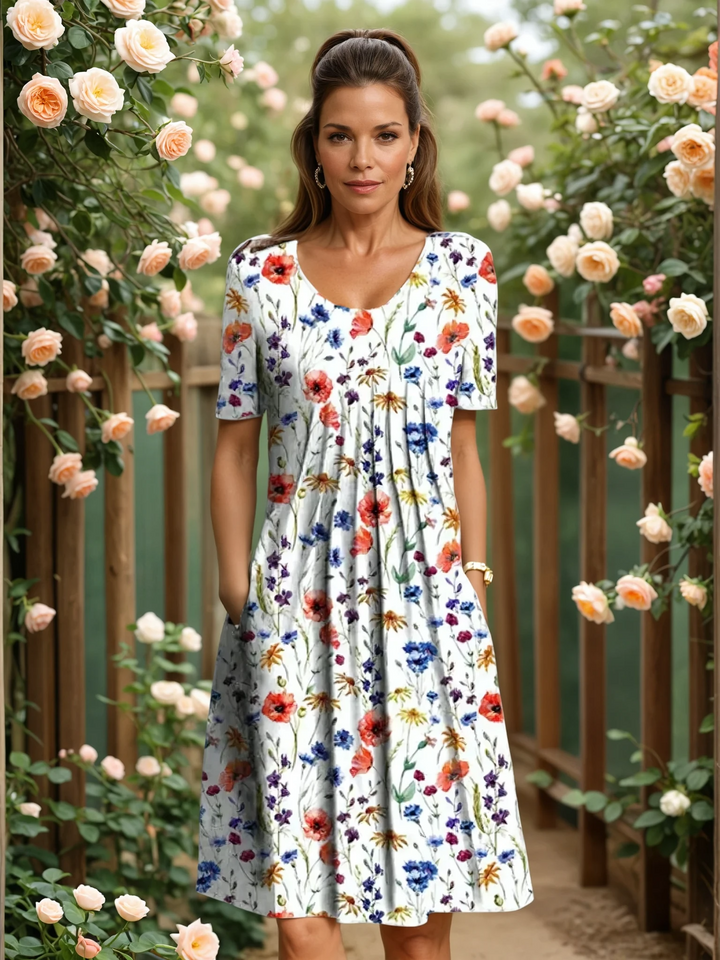 Women's V-neck A-line midi dress with vibrant floral print, perfect for spring & summer casual elegance.