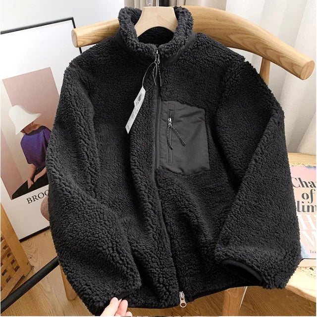 Warm women's zip-up jacket for fall & winter. Features a high collar & cozy fleece lining for comfort.