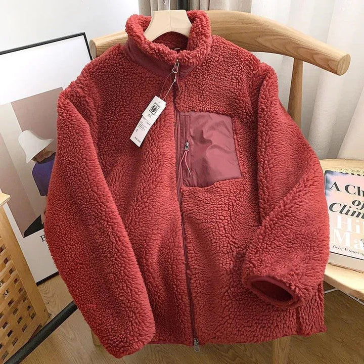 Textured fabric of a cozy women's zip-up jacket. Comfortable & soft for stylish fall/winter outerwear.