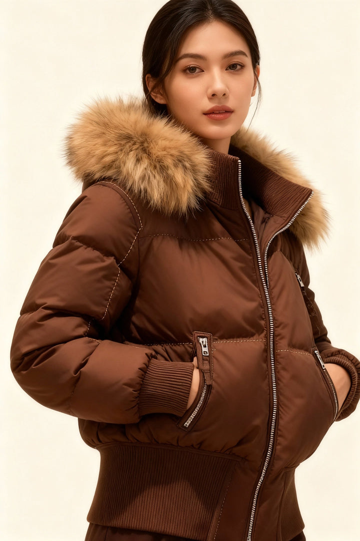 Warm women's outerwear: quilted winter jacket with stylish faux fur hood.