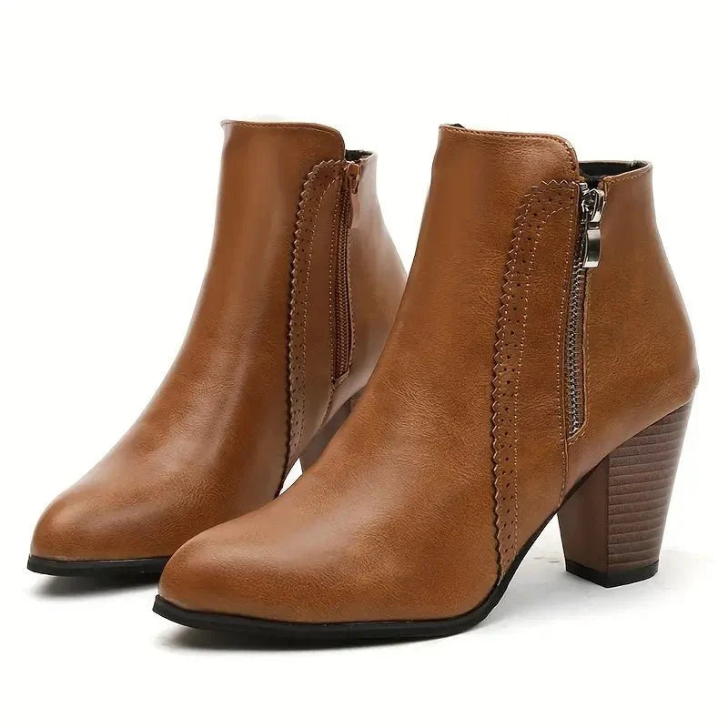 Elegant women's ankle boots with a comfortable block heel, easy side zip access & sophisticated scalloped trim.