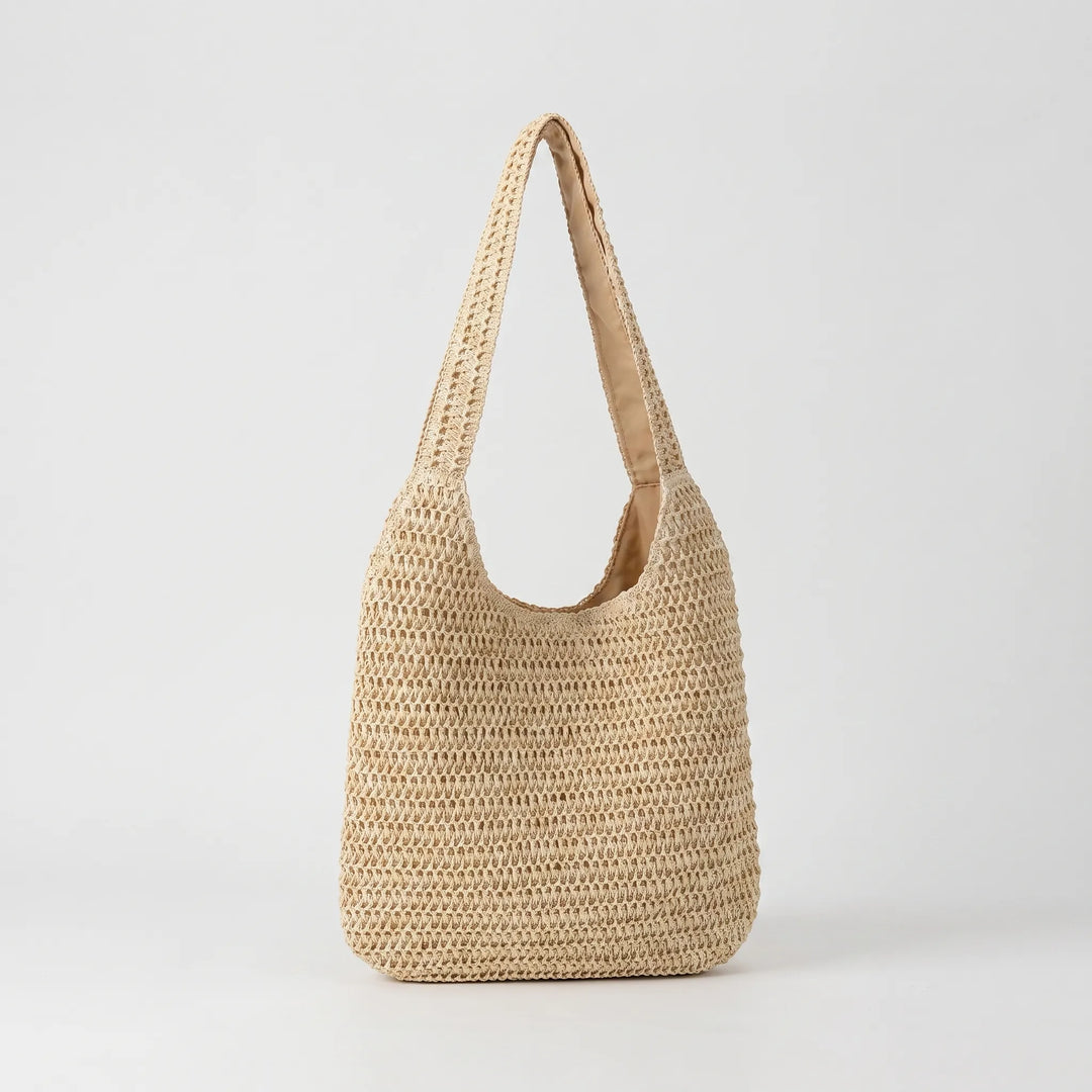 Handmade crochet oversized shoulder bag for women, a stylish beach tote for sunny days.