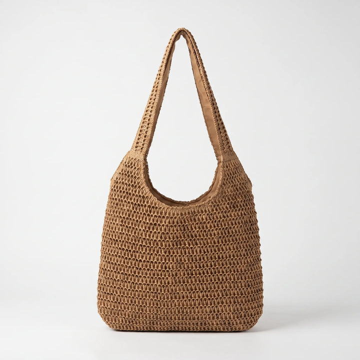 Fashionable women's oversized crochet tote, essential beach bag for summer style & vacation.