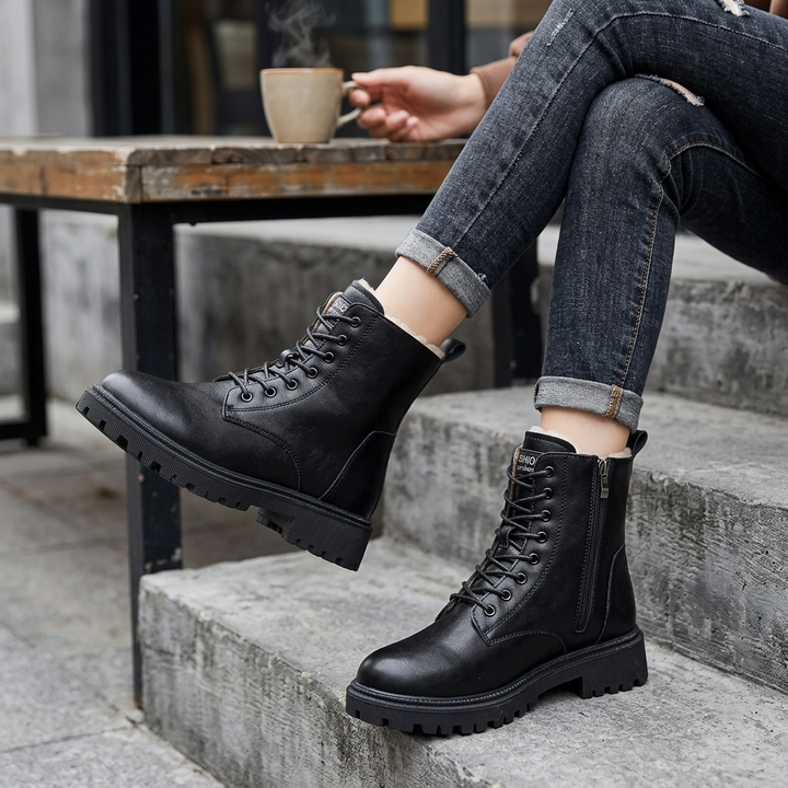 Women's sleek black lace-up ankle boots. Versatile everyday combat boots with a lug sole.