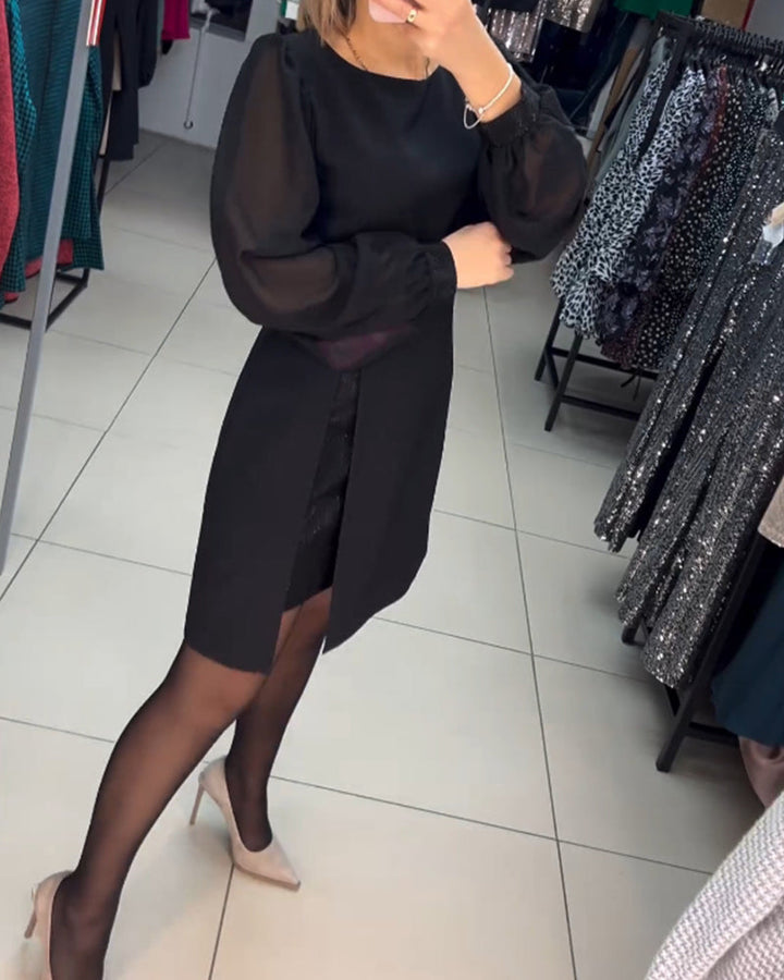 Chic black cocktail mini dress with long sheer sleeves and an elegant slit, perfect for a night out or formal event.