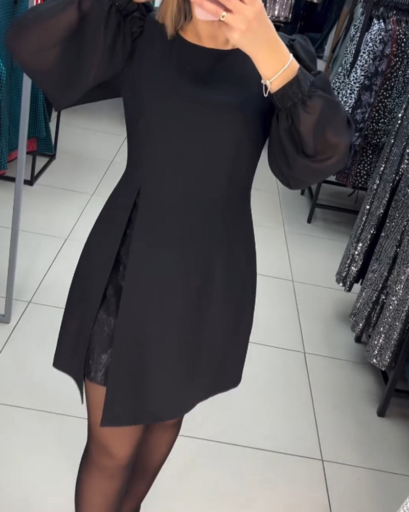 Women's black mini dress with elegant sheer long sleeves & a stylish side slit, perfect for parties and evening wear.