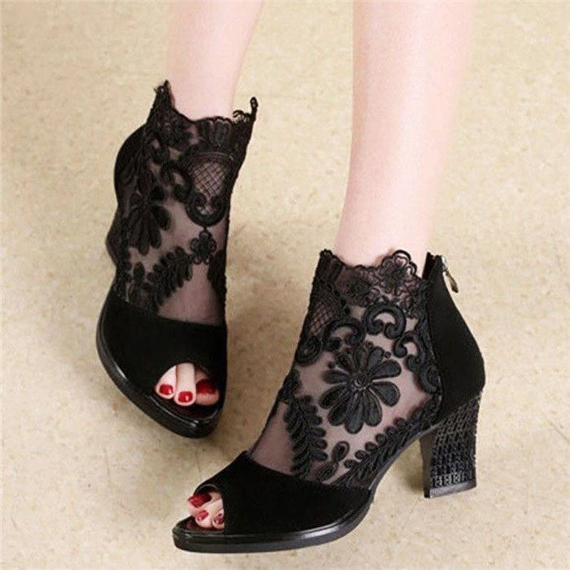 Elegant women's black peep toe heels with delicate floral mesh ankle strap, perfect for evening or formal wear.