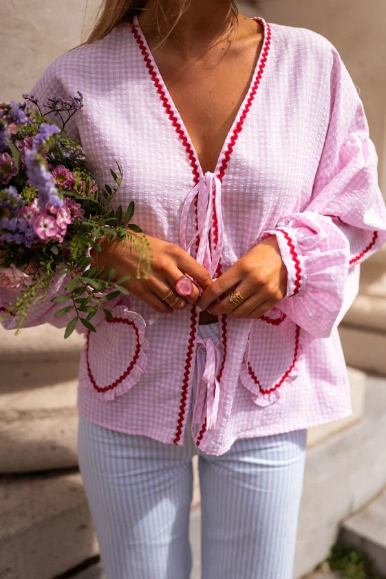 Versatile women's long-sleeve tie-front blouse with ruffles, ideal for chic casual or elegant wear.