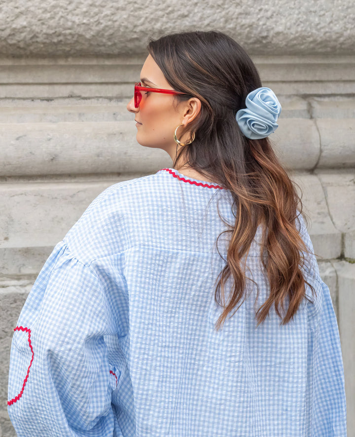 Women's versatile long-sleeve tie-front blouse, featuring stylish puff sleeves and ruffled details.