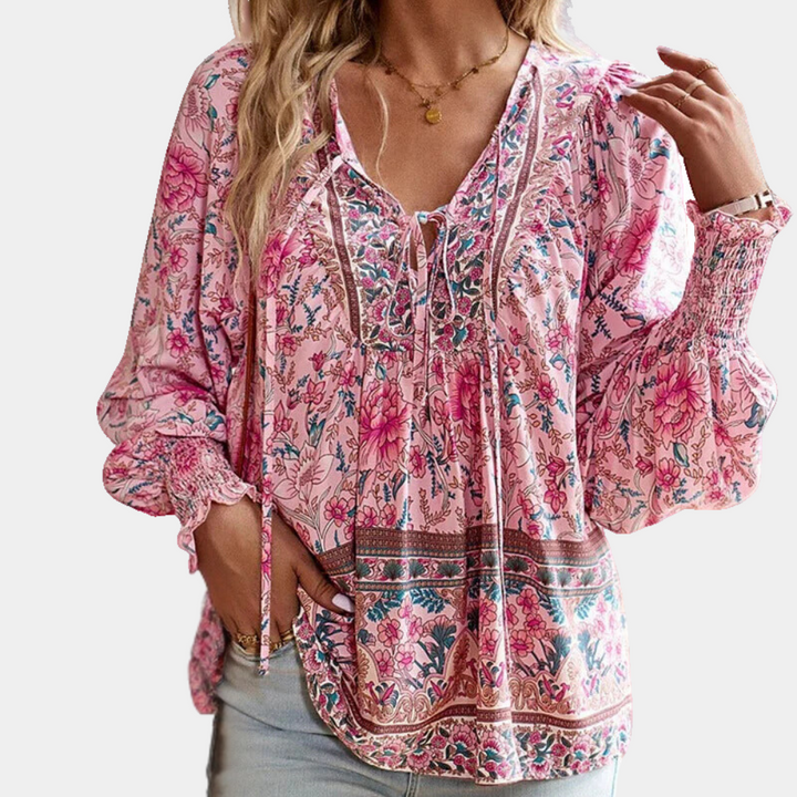 Stylish floral print tie neck blouse for women, with comfortable smocked cuffs; perfect for chic everyday wear.