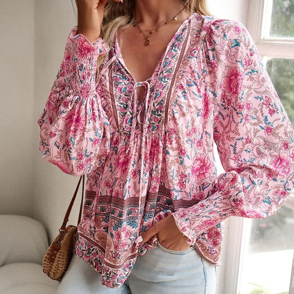 Women's floral print tie neck blouse with smocked cuffs, perfect for elegant spring & summer casual wear.