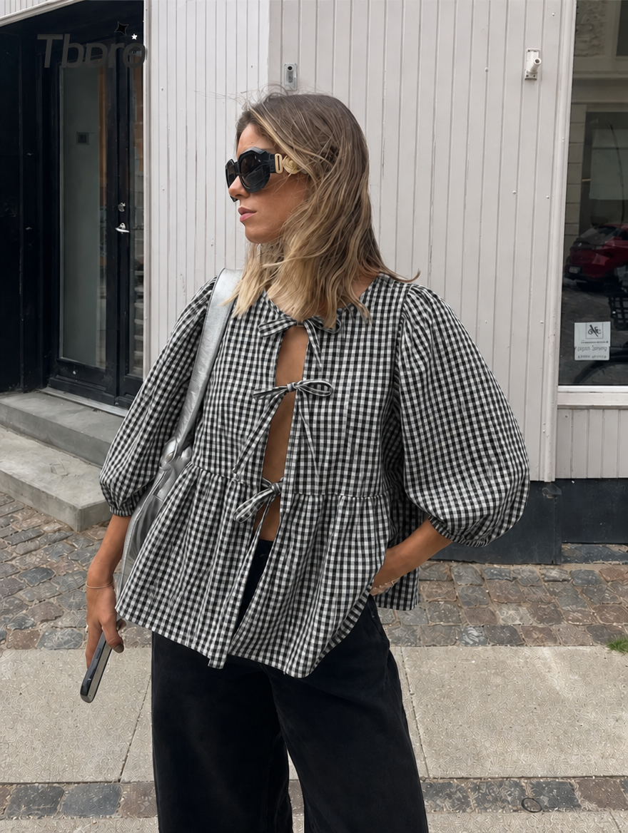 Versatile women's blouse: chic tie front, elegant puff sleeves. A must-have top.