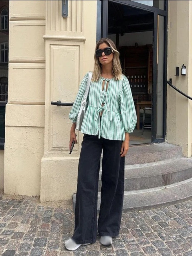Versatile chic tie front top for women, designed with elegant puff sleeves.