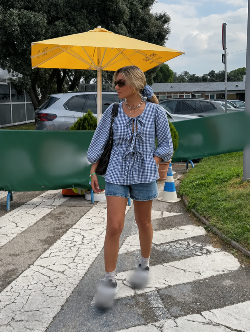Chic women's top with a flattering tie front and beautiful puff sleeves.