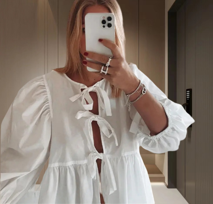 Stylish women's striped tie front top, perfect with elegant puff sleeves.