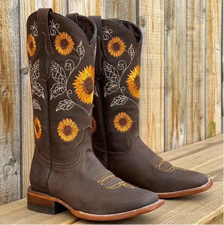 Brown women's western boots with elegant sunflower embroidery, square toe, and block heel. Perfect cowgirl fashion.