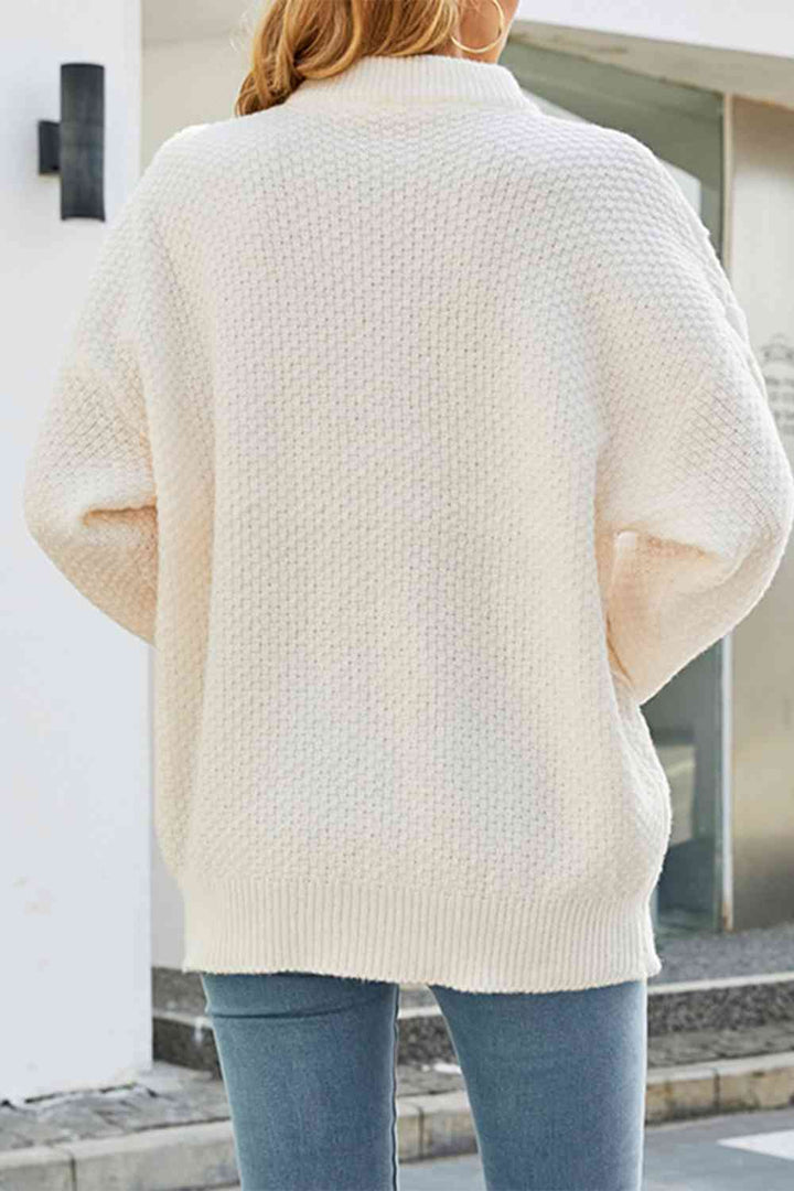 Stylish women's cable knit sweater with a classic crew neck and comfortable oversized fit.