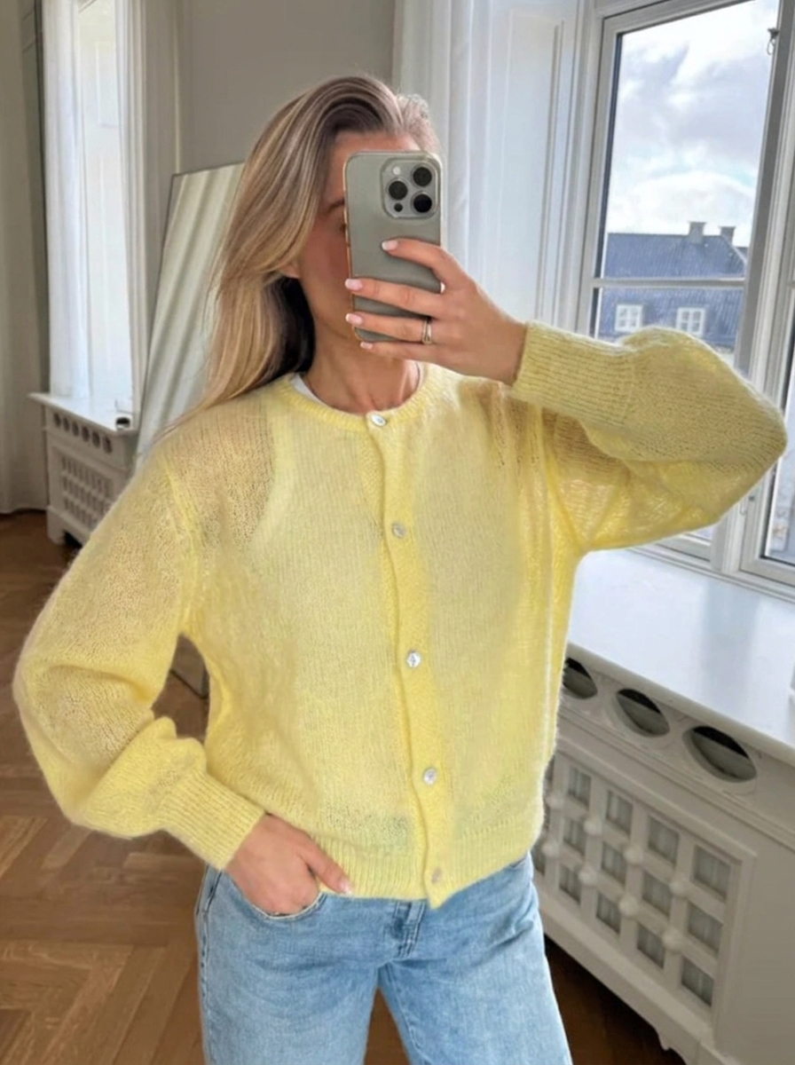 Soft, fluffy women's oversized cardigan. Comfortable knit with round neck & button front. Perfect for everyday style.