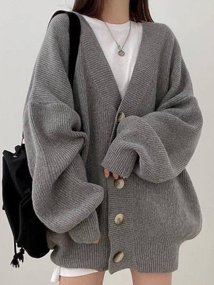Women's oversized cardigan featuring a stylish button front, providing a comfortable, relaxed fit for any occasion.