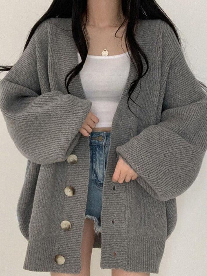 Stylish women's oversized cardigan, perfect for layering. Features a button front for versatile, comfortable casual wear.