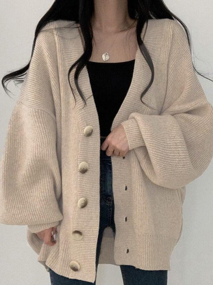 Chic women's oversized button-front cardigan in a relaxed fit, perfect for versatile layering & everyday fashion.