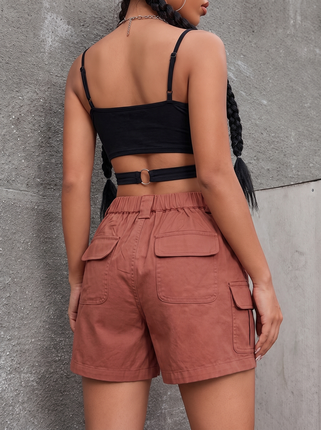 Women's high-waist cargo shorts with side flap pockets, a casual bottom designed for comfort and utility in summer.