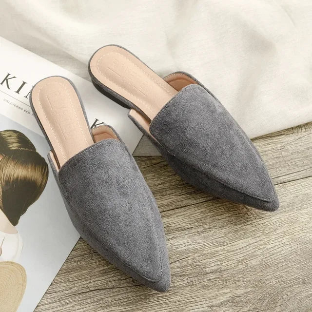 Comfortable women's pointed toe mules with a low block heel, perfect for everyday wear and office chic.