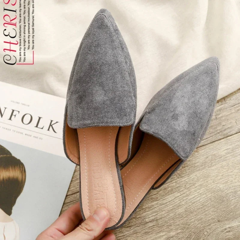 Women's pointed toe slip-on mules in a versatile color, offering effortless style for casual or elegant wear.