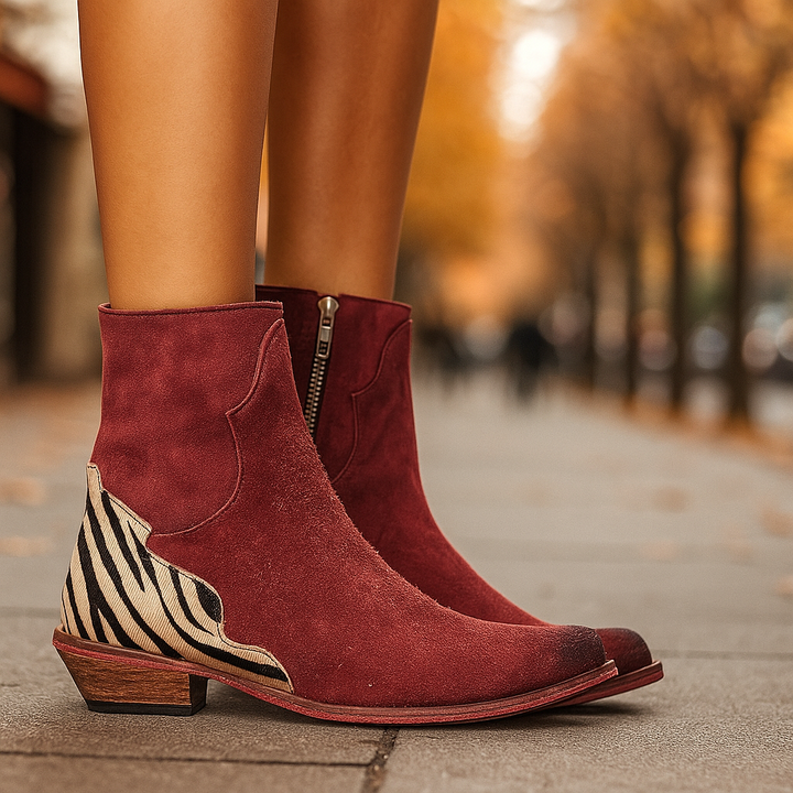 Classic women's Chelsea ankle boots with a modern twist: a distinctive zebra print low heel. Versatile footwear.