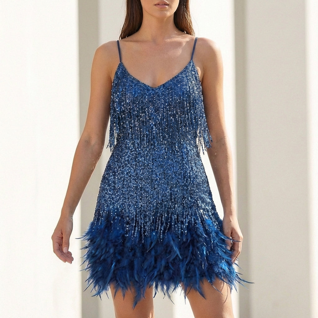 Shimmering women's sequin cocktail dress with playful feather hem. A dazzling mini dress for parties & events.