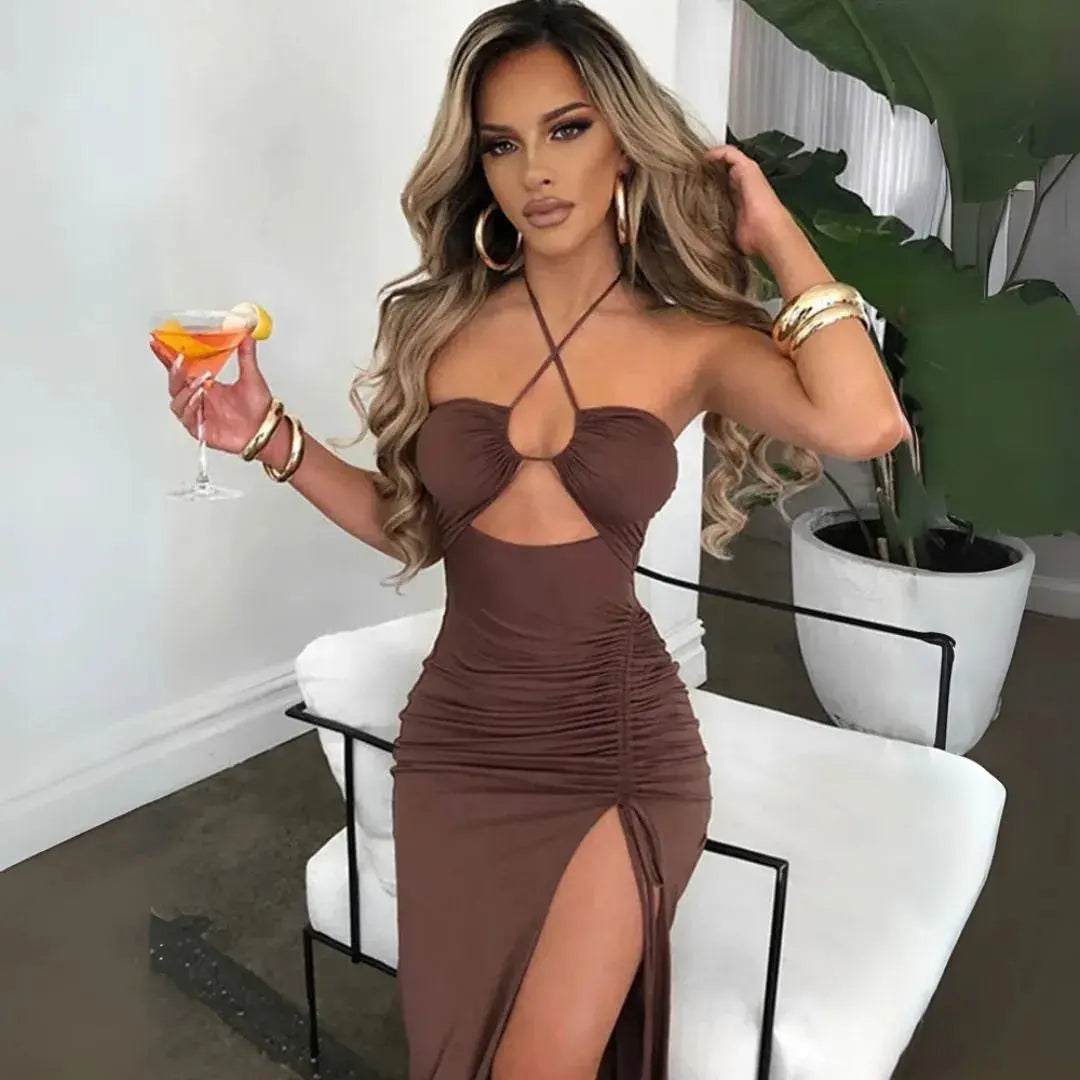 Sophisticated women's sculpted fit maxi evening gown with halter neck and modern cutout design.