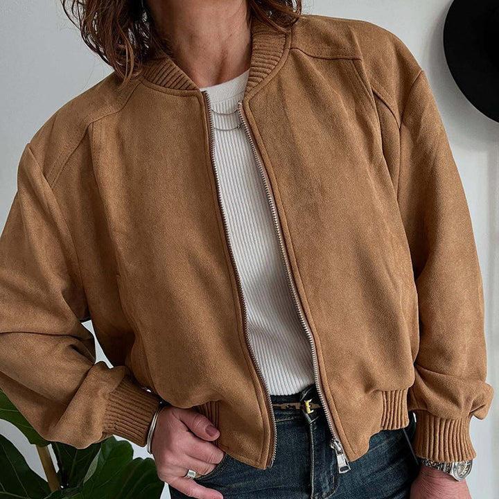 Versatile women's cropped bomber jacket, ideal for spring/fall, featuring a zip-up design & ribbed cuffs.