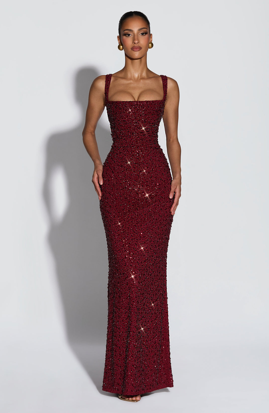 Sophisticated women's sequin prom dress, a floor-length formal gown with a stylish square neck design.