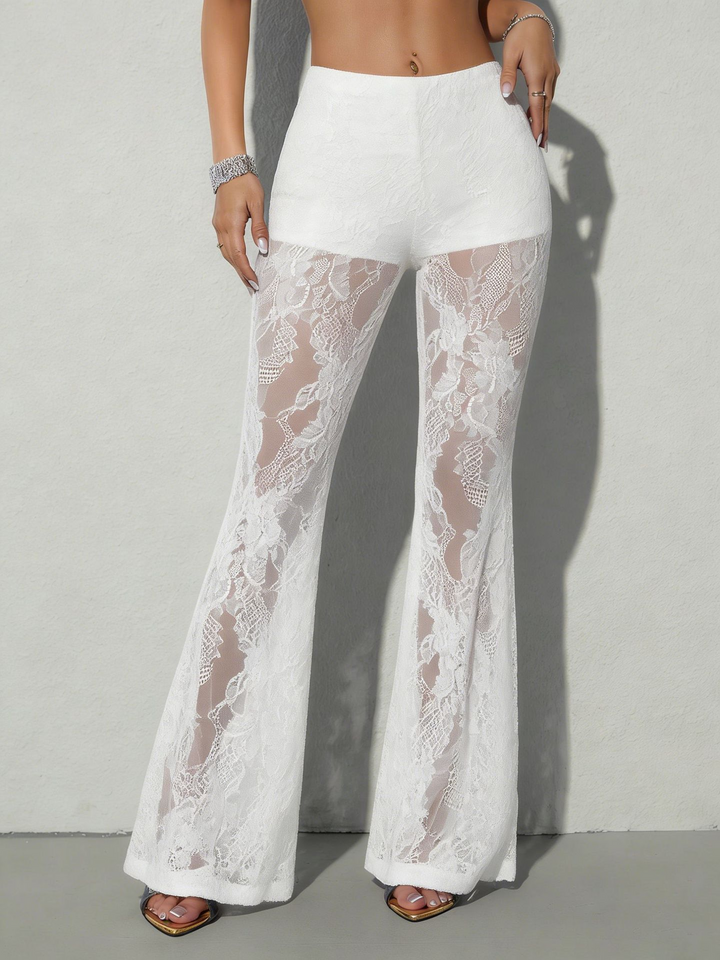 Women's high waist flare pants with sheer side panels, ideal for evening wear & bold fashion statements.