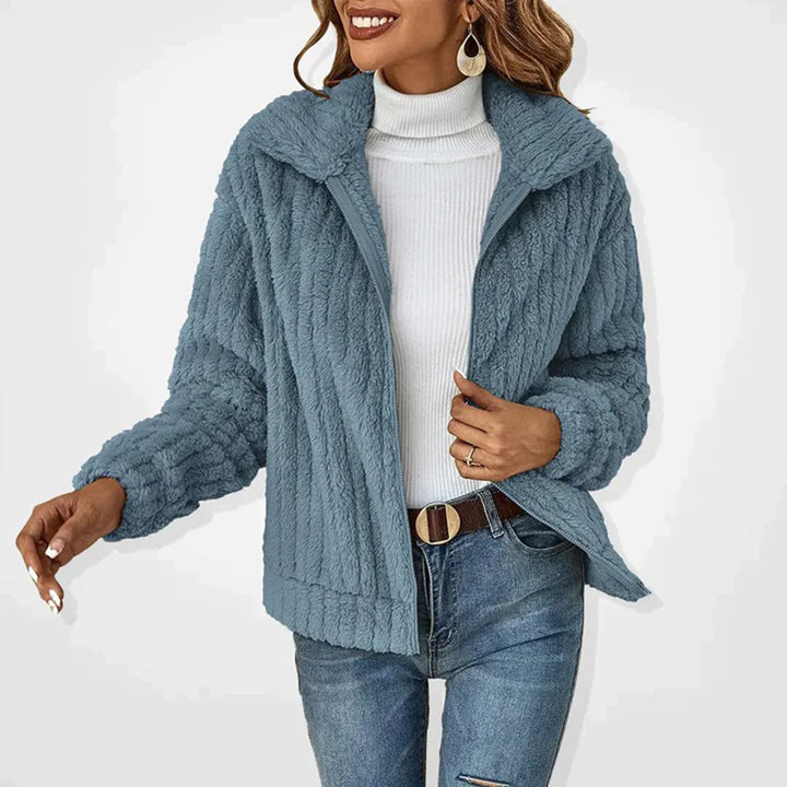 Warm women's fleece layering vest in Ember, ideal for comfort wear and chic casual fall fashion.