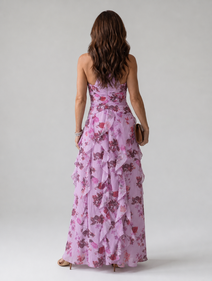 Sleeveless women's maxi dress with a beautiful floral pattern, halter neckline & delicate ruffles for summer.