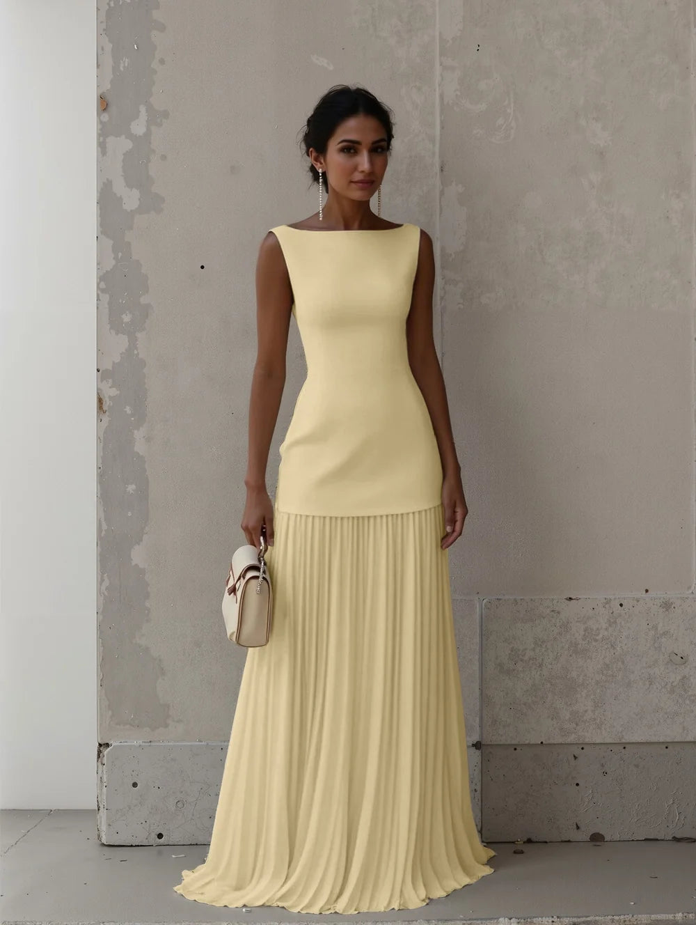 Women's formal evening dress featuring a chic boat neck and elegant pleated skirt detail.