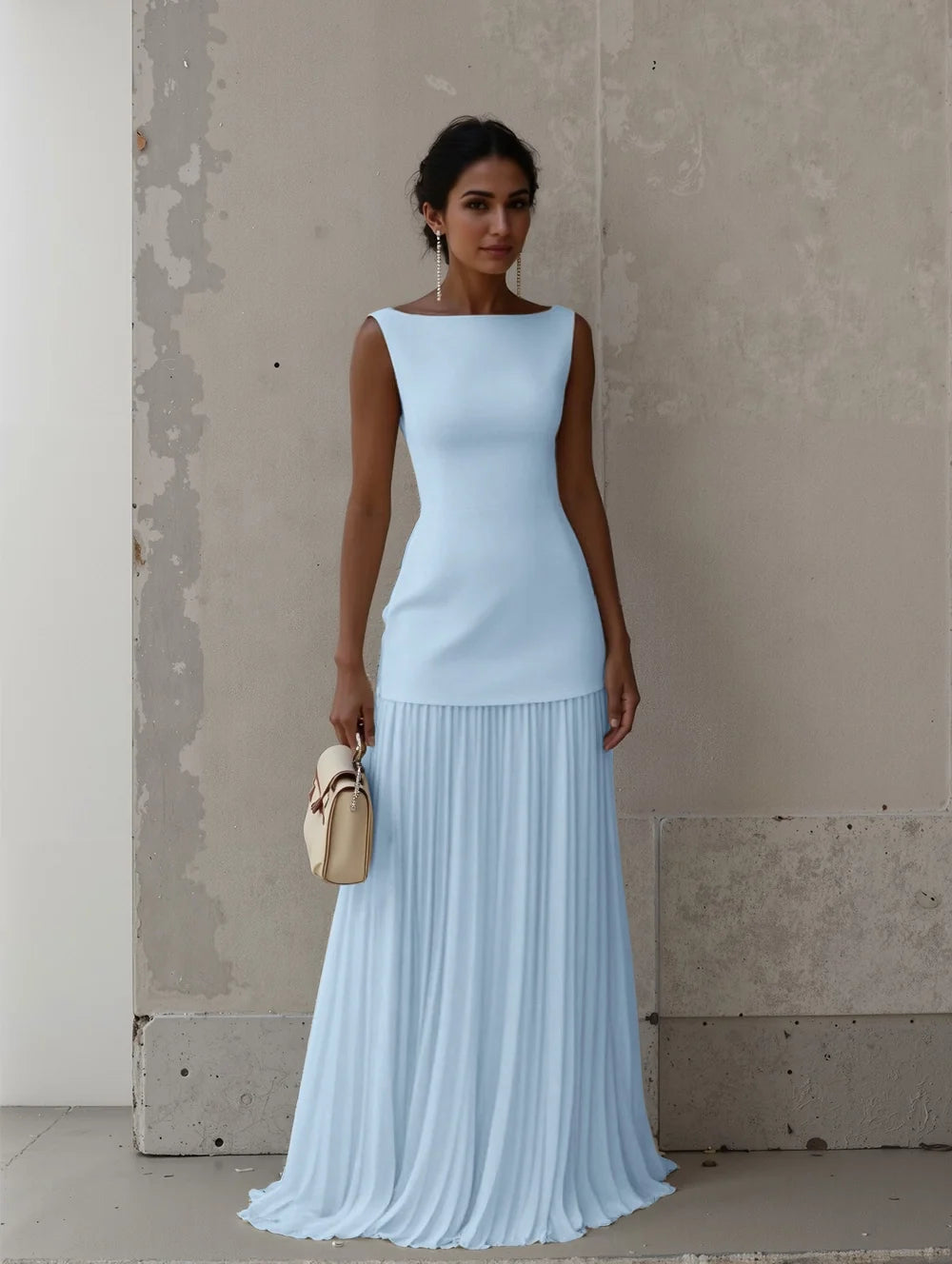 Women's formalwear: a graceful boat neck pleated evening gown, perfect for black tie occasions.