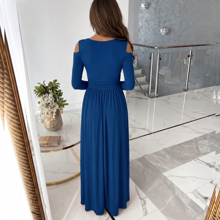 Women's elegant cold shoulder formal maxi dress, showcasing its V-neckline and high slit detail. Occasion wear.