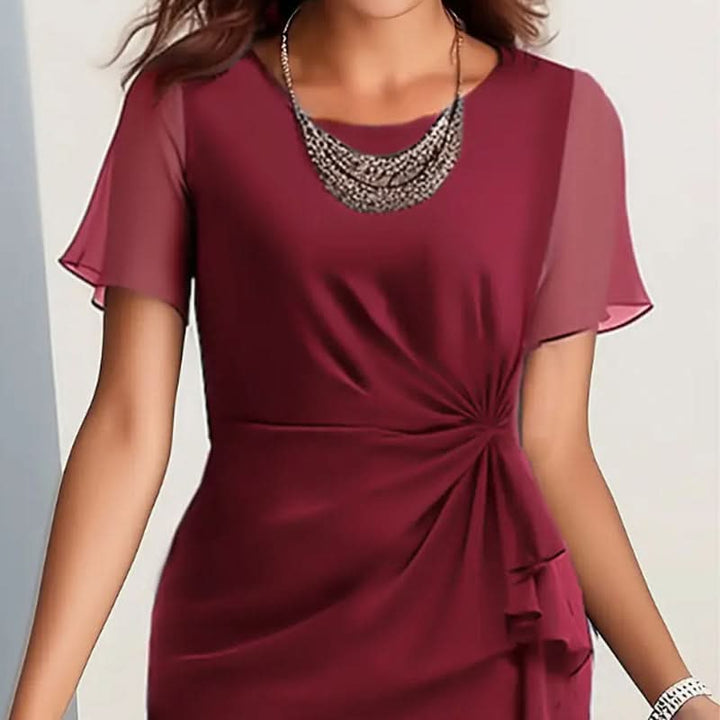 Stylish back view of a women's elegant midi dress featuring flutter sleeves & a graceful ruffle hem.