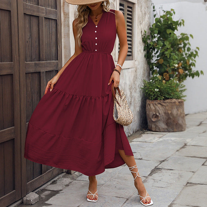 Beautiful women's elegant sundress, tiered and sleeveless, featuring a stand collar and button detail, perfect for summer.