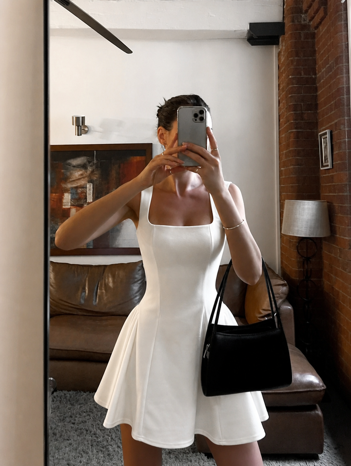 Chic white sleeveless mini dress, square neck A-line, excellent women's party or event attire.