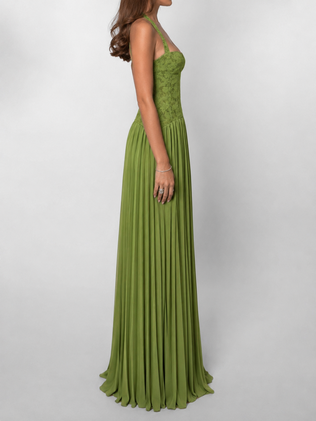 Sophisticated halter neck maxi dress for women, featuring a structured corset, pleated skirt, and chic lace-up back.