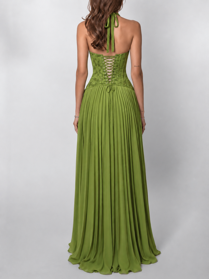 Chic women's evening gown: elegant halter neck, flattering corset waist, pleated maxi skirt. Ideal for special events.