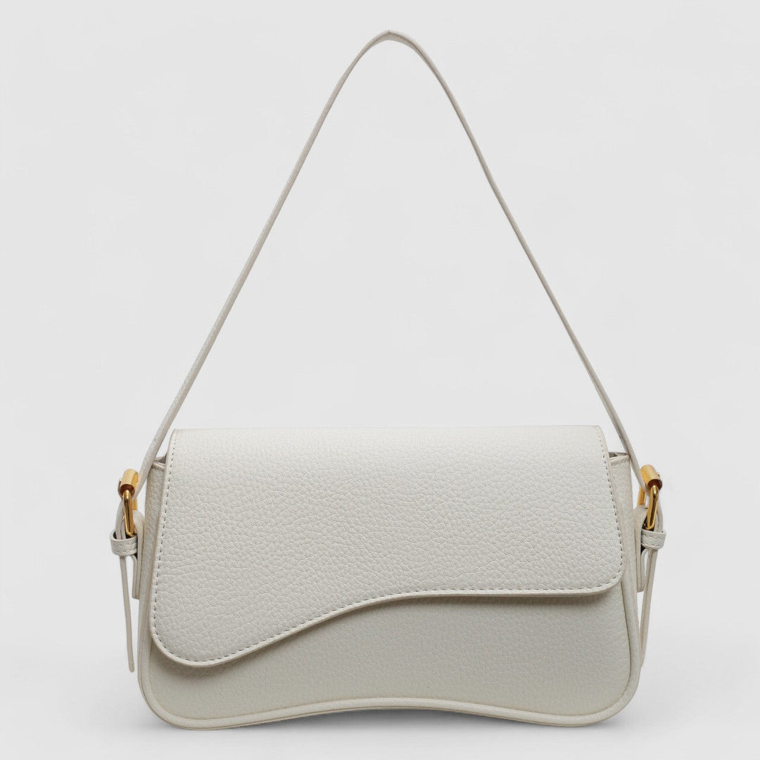 Chic women's structured shoulder bag with unique wave flap. A stylish and elegant everyday handbag accessory.